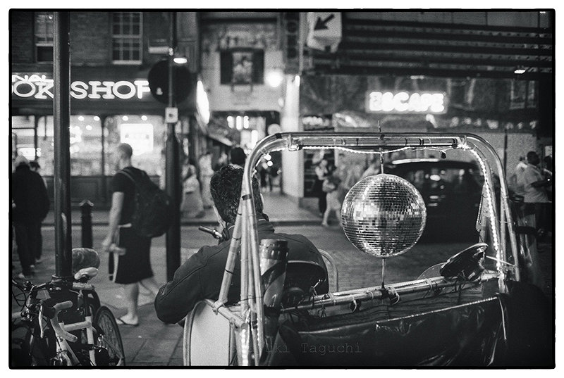 London bicycle rickshaw with a mirror ball