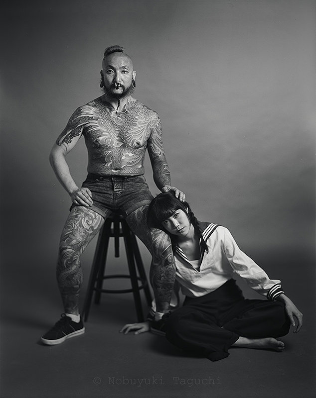 Tattooed Man with Girl