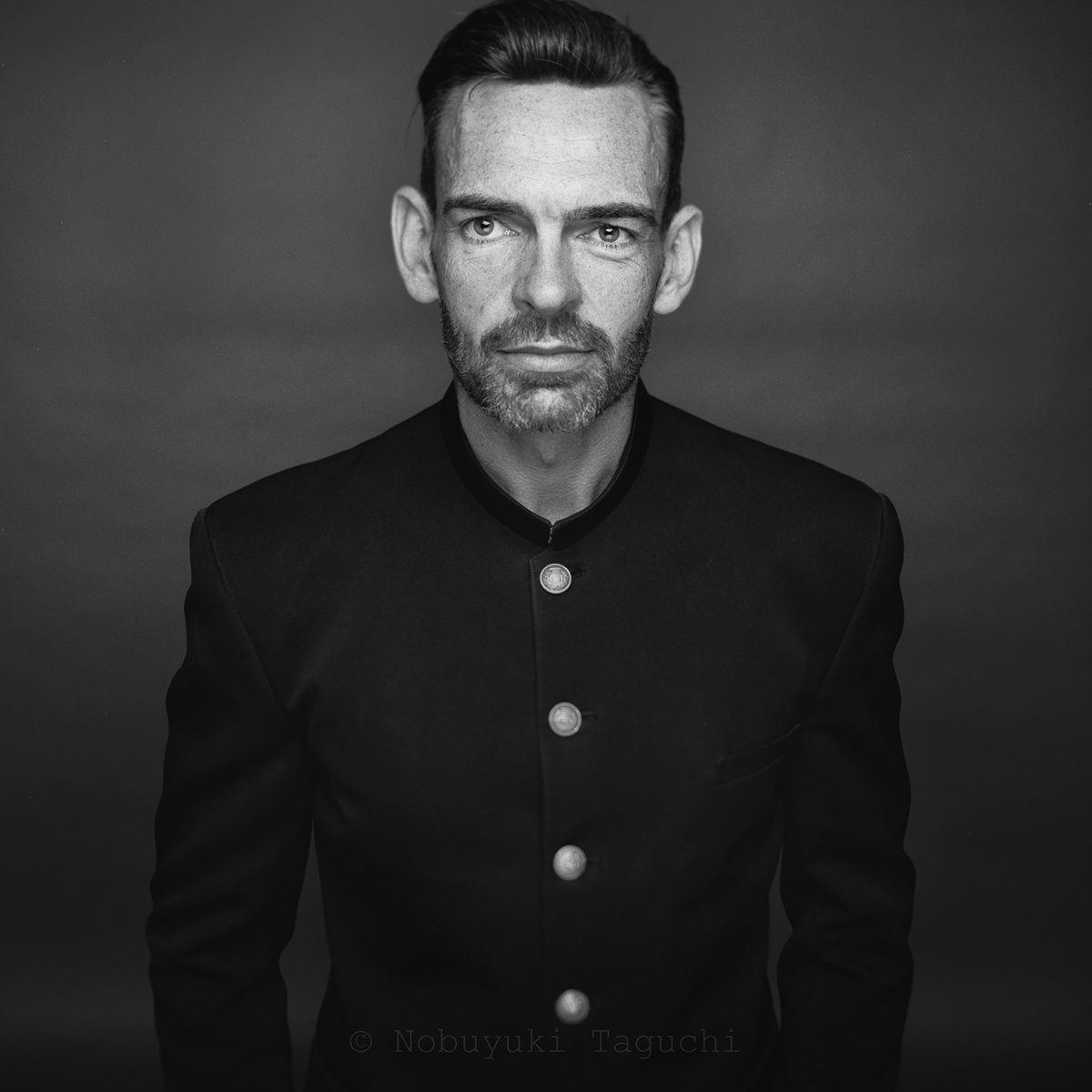 Portrait photograph of John McKenzie