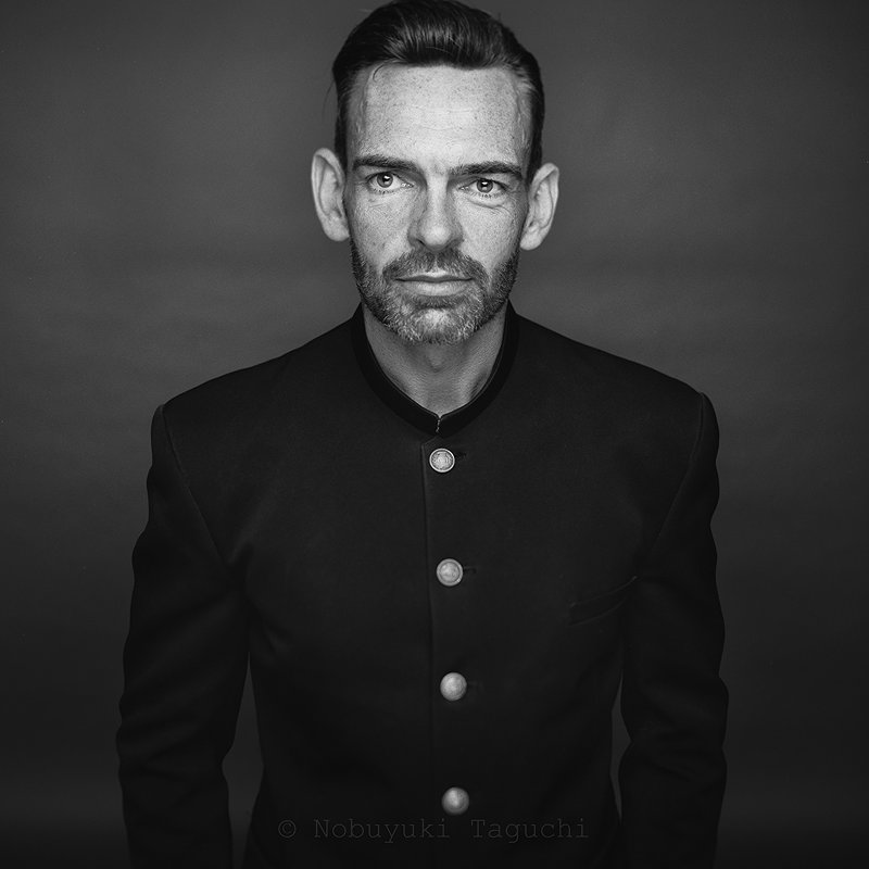 Portrait photograph of John McKenzie